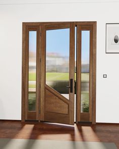 an open wooden door in a white room with wood flooring and glass panels on the doors