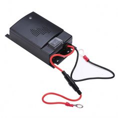 an electronic device with a red cord attached to it