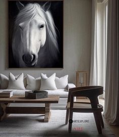 a living room with a white horse painting on the wall