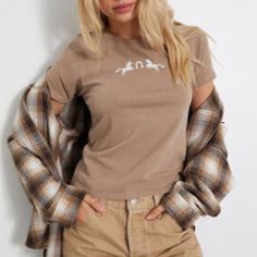 -Brown/Tan Color -Pacsun Short Sleeve Tee/Crop Tee -Size Medium -Nwt -Super Cute! Make Me An Offer! Feel Free To Bundle And Save (Pacsun, Brown, Tan, Boho, Bohemian, T Shirt, Crop Top, Horse, Horseshoe, Western, Summer, Casual, Medium, Cute, Short Sleeve, New With Tags, Nwt, Golden Hour) Casual Brown T-shirt For Summer, Trendy Brown T-shirt For Spring, Casual Brown Summer T-shirt, Casual Beige T-shirt For Fall, Brown Graphic Tee For Spring, Tan Short Sleeve Graphic Tee, Coffee Color Short Sleeve T-shirt With Screen Print, Brown Short Sleeve T-shirt With Graphic Print, Brown Sporty Short Sleeve T-shirt