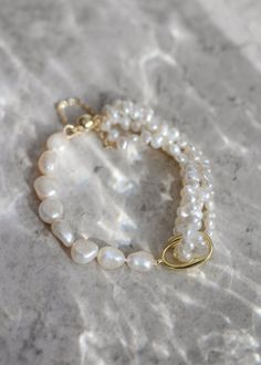 *Enjoy 10% off for a limited time. Use coupon code LIMITED10 at checkout. Does not include bespoke or custom changes. A multi-strand pearl bridal bracelet that hugs your wrist, Kindred is all about timeless elegance and a dash of playful sophistication. Perfect for formal occasions and weddings, Kindred features layers of lustrous pearls that dance together in harmonious beauty. This bracelet adds a touch of classic charm with a modern twist, making it an ideal accessory for brides, bridesmaids, or anyone looking to add a bit of shimmer to their special day. * DETAILS * > Designed and handmade in Australia > Gold plated clasp, freshwater pearls, silk beading thread > Sizes: 6.5 inches (XS), 7 inches (S), 7.5 inches (M), 8 inches (L), 8.5 inches (XL) > Made to order: Production times in tab Luxury Akoya Pearl Bracelets For Wedding, Baroque Pearl Bracelets For Wedding, Baroque Pearl Wedding Bracelets, Luxury Pearl Bracelets For Wedding, Luxury Pearl Bracelet For Wedding, Luxury Baroque Pearl Bracelet As Gift, Luxury Baroque Pearl Bracelet For Gift, Luxury Baroque Pearl Bracelet Gift, Wedding Baroque Pearl Chain Bracelet