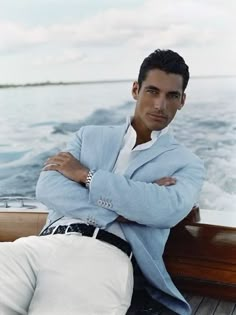 Model David Gandy. Summer Chic. Dark haired man on a boat. Blue blazer, white pants. Linen Beach Wedding, Male Costumes, Beach Wedding Groom, Prom For Guys, Prom Dinner, Man Sitting, David Gandy, On A Boat