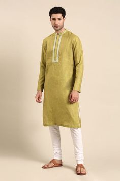 Green linen kurta with embroidered placket and collar. Paired with a solid white pant. - Aza Fashions Traditional Long Sleeve Kurta With Embroidered Cuffs, Eid Linen Long Sleeve Sets, Linen Long Sleeve Sets For Eid, Traditional Long Sleeve Linen Kurta, Eid Linen Kurta With Embroidered Border, Festive Linen Kurta With Embroidered Border, Festive Cotton Kurta With Embroidered Cuffs, Traditional Linen Sets For Diwali, Festive Long Sleeve Linen Sets