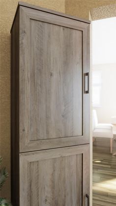 an open door to a room with a chair and table in the background on carpeted flooring