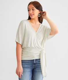 Women's Sheen Wrap Top In Cream By Daytrip., Women's Ivory Surplice knit strappy top Bust measures 38 on size small Body length 23 on size small. 93% Polyester 7% Spandex. Hand wash cold. Do not bleach. Line dry. Do not iron.. Measurements: Bust -Fullest part of bust with arms at sides. Waist -Circumference of natural waist: above belly button below rib cage. Hips -Standing with feet together fullest part of hips. WOMEN'S TOP SIZE CONVERSION CHART Size US/CAN BUST WAIST XXS 00 29-30 22-23 XS 0 3 Strappy Top, Conversion Chart, Waist Circumference, Top For Women, Women Shirts Blouse, Shirts Blouses, Women's Shirts, Wrap Top, Rib Cage