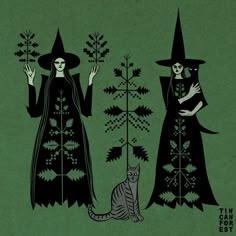 two witches standing next to each other near a cat