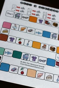 a close up of a game board with words and pictures on it's side