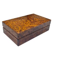 a wooden box sitting on top of a white surface