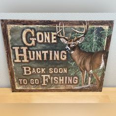 a sign that says gone hunting back soon to go fishing with a deer on it