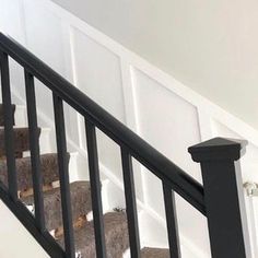 an image of a stair case with teddy bears on the bannister railings