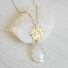 Gold Lotus Flower with Moonstone Teardrop Pendant Necklace Elegant Jewelry With Moon Charm For Meditation, White Holistic Jewelry For Gifts, Elegant Teardrop Pendant Necklace For Meditation, White Spiritual Crystal Necklace With Moon Charm, Elegant Teardrop Necklaces For Meditation, Spiritual White Birthstone Necklaces, Spiritual White Necklace As Gift For Her, Teardrop Gemstone Pendant For Meditation, Delicate Gemstone Necklace For Meditation