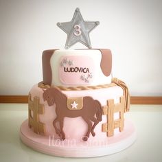 a pink and brown horse themed birthday cake