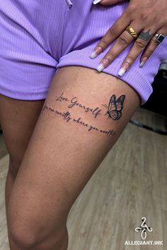 a woman's legs with a butterfly tattoo on her left leg and the words, i love you so much