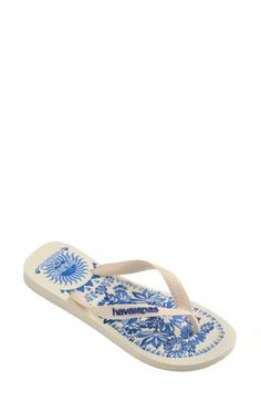 FARM Rio's iconic prints add a summery splash of the tropics to the textured footbed of this lightweight flip-flop serving grab-and-go comfort in style. Cushioned footbed Synthetic upper and lining/rubber sole Made in Brazil White Tropical Flip Flops For Beach Season, Tropical Style Surfing Flip Flops For Summer, Summer Vacation Slippers With Branded Insole, Beach Season Flip Flops With Textured Footbed, Summer Surfing Sandals With Round Toe, Summer Surfing Sandals With Removable Insole, Cushioned Flip Flops For Beach Season And Pool, Cushioned Flip Flops For Pool And Beach Season, Beach Season Cushioned Flip Flops For Pool