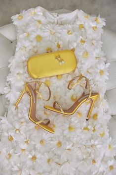 The Limoncello Yellow Bella Clutch is a bold yellow bridal handbag, crafted with duchess satin by Italian artisans featuring a lively pop of color. Planning a maximalist wedding day or looking to make a powerful statement at your next gala? Inspired by Italy’s Amalfi Coast, a coastline featuring terraced vineyards and cliffside lemon groves, this luxury handbag will make a statement on your wedding day, at a red-carpet affair, or on a tropical destination trip. First seen on celebrity stylist Mi Luxury Chic Yellow Satchel, Elegant Yellow Bags For Formal Occasions, Elegant Yellow Bag For Formal Occasions, Elegant Yellow Formal Bag, Elegant Yellow Formal Bags, Yellow Clutch Bag For Party, Yellow Rectangular Evening Bag For Party, Yellow Luxury Clutch Evening Bag For Party, Yellow Clutch Evening Bag For Party