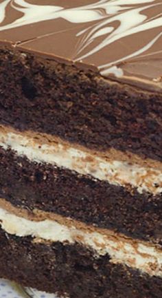 a slice of chocolate cake with white frosting