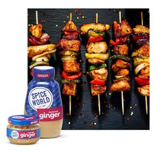 grilled chicken skewers with spices and sauces next to an advertisement for spice world