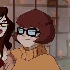 two women with glasses standing next to each other