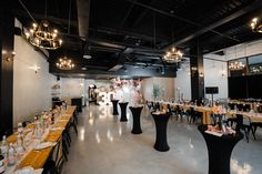 an empty restaurant with tables and chairs set up for a formal dinner or function event