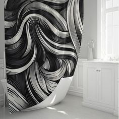 a black and white shower curtain with swirls on it in a bathroom next to a window