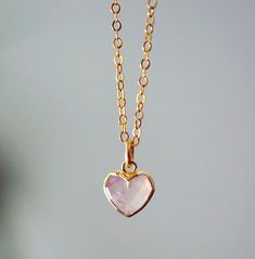 "Rose Quartz Heart Necklace - 14k Gold Filled or Sterling Silver Looking for a unique accessory for some self love, or love for that special someone? Crafted from 14k gold filled or sterling silver and natural Rose Quartz, this pendant is the perfect, sparkling way to show anyone how much you care.  Rose Quartz is a stone of love. It is believed to restore trust & harmony in relationships and encourage unconditional love. It purifies the heart and promotes self love, inner healing, and friendshi