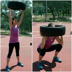 a woman holding up a tire on top of a tennis court