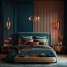 a bedroom with blue walls, gold accents and a large bed in the middle of it