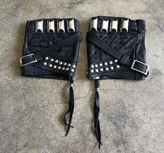 KNUCKLE DUSTER Black Leather Fingerless Motorcycle Driving Gloves Michael Grant from LA guns wears our gloves every time he performs. He likes the fingerless, open style glove so that his fingers can move freely when he is playing guitar. If you don't know who he is, check him out. I made these specifically with him in mind, as most of the stuff we have made for him is accented with silver accessories. These Knuckle Dusters are kind of a spin of the Fury Road gloves. I wanted them to have the sa Motorcycle Driving, Wear Rings, Guitar Drawing, Knuckle Duster, Gold Grillz, Costume Gloves, Leather Bra, Fingers Design, Rugged Look