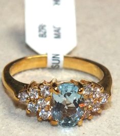 Up for auction is a beautiful vintage 14K yellow gold plated ladies ring with natural blue topaz accented with CZs. Ring size: 7 - 7.25. Gorgeous designer artwork. You have to see this beauty to appreciate it. The ring is brand new, comes in original box, with paperwork. No reserve!                   PLEASE READ THE FOLLOWING ATTENTIVELY BEFORE BIDDINGSuccessful buyer agrees to pay $5.50 above the winning bid for USPS shipping, handling, and tracking to anywhere in the Continental US only; Hawaii, Alaska and Puerto Rico extra (please contact the seller). The winning bidder must reply with payment within 72 hours (3 days), otherwise it will be assumed that you do not intend to honor your bid and the item will be relisted for sale. Non-paying bidders will be reported; we always leave feedbac Gold Aquamarine Diamond Ring With Gemstones, Fine Jewelry Gold Diamond Ring With Blue Topaz, Gold Aquamarine Diamond Ring, Gold Diamond Ring With Aquamarine, Gold Aquamarine Diamond Ring For Anniversary, Gold Heirloom Style Blue Topaz Birthstone Ring, Heirloom Gold Blue Topaz Birthstone Ring, Heirloom Gold Birthstone Ring With Blue Topaz, Gold Topaz Ring With Accent Stones For Anniversary