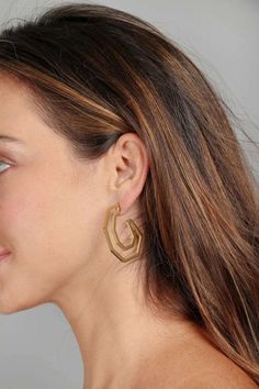 Our Angled Earring is the pair you will reach for again and again. This lightweight trendy hoop earring gets a modern refresh with its six-angled sides and open silhouette. Materials : Gold Plated Brass, Stainless steel Size: 1.5" x 1.5" Post Backing Imported Modern Geometric Metal Hoop Earrings, Modern Geometric Hoop Earrings With Ear Wire, Again And Again, Geometric Earrings, Curator Style, Gold Earrings, Hoop Earrings, Brass, Stainless Steel