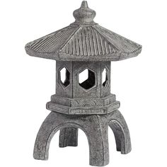 a small stone pagoda sitting on top of a white background