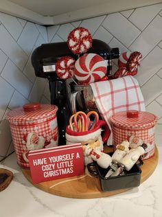 the kitchen counter is decorated with red and white christmas decor, including candy canes