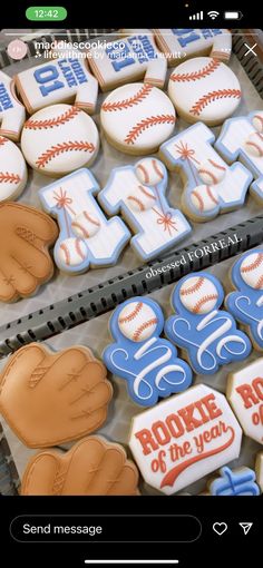 baseball themed cookies are on display for sale