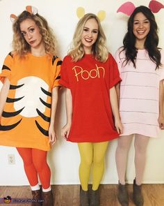 three girls dressed up as winnie the pooh and tigger from the disney movie