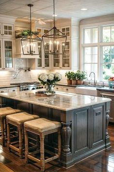 a large kitchen island with stools next to it