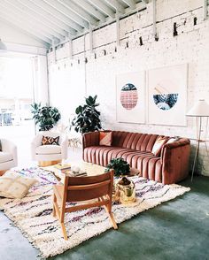 a living room filled with furniture and decor