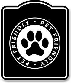 a black and white sign with a dog's paw in the center that says friendly pet