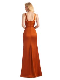 a woman in an orange dress is looking back