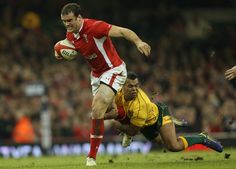 two rugby players in action on the field