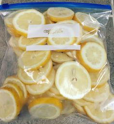 a bag filled with sliced lemons sitting on top of a counter