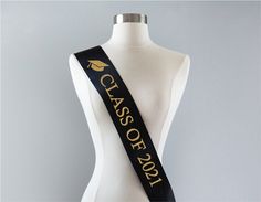 "We had the incredible honor of being selected to create party sashes for the movie, \"Rough Night.\" Our sashes were worn by Scarlett Johansson, Kate McKinnon, Zoë Kravitz, Jillian Bell, and Ilana Glazer. This beautiful custom \"Class of 2021\" sash is made of silky double-faced satin ribbon with sparkly glitter lettering. It's enough to make anyone feel like a movie star! You can get the same luxurious sash worn by Scarlett Johansson here! The glitter is made of high quality material and will Sash Graduation, Jillian Bell, Senior Sash, Class Of 2022 Graduation, Graduation Sash, 2022 Graduation, Pink Fish, Kate Mckinnon, Gift Photo