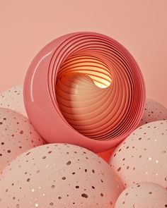 an unusual pink object surrounded by white balls