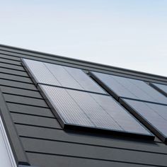 the roof of a house with solar panels on it