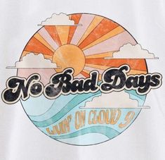 a white shirt with the words no bad days on it and an orange sun in the background