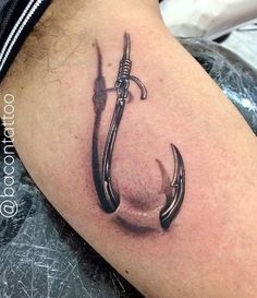 an anchor tattoo on the thigh