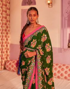 Editor's Note Emerald Sea Green Royal Paisley Hand Embroidered Saree And Contrasting Border Paired With Red Velvet Blouse. Fabric: Pure Crepe, Cotton Velvet Color: Green Care: Dry Clean Only Disclaimer: Product Color May Slightly Vary Due To Photographic Lighting Sources Or Your Monitor Setting. About the Designer Siddhartha Bansal, label epitomise its design philosophy touring around " Golden bird" nation to present day India, in the wanderlust for rich Craft and Culture presenting to the world Traditional Green Blouse With Dupatta, Traditional Green Choli With Chikankari Embroidery, Pre-draped Saree With Multicolor Embroidery And Zari Work, Green Blouse Piece With Floral Embroidery For Navratri, Multicolor Embroidered Pre-draped Saree With Zari Work, Traditional Georgette Blouse With Floral Embroidery, Green Georgette Choli With Floral Embroidery, Green Georgette Blouse Piece With Intricate Embroidery, Multicolor Pre-draped Saree With Floral Embroidery For Festivals