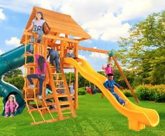 children playing on a wooden playset with slide and climbing frame in the grass outside