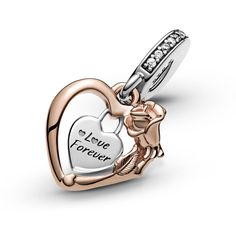 Deliver a message of love with the Heart & Rose Flower Dangle Charm. Hand-finished in sterling silver and Pandora Rose™, this design includes a heart-shaped frame with a padlock heart dangling within it. The frame features intricate rose petal and leaf details, while the padlock includes the engraving “Love forever” and sparkling cubic zirconia decorate the bail. Inspired by William Shakespeare's play Romeo & Juliet, gift this piece to the one that has your heart. Romeo Und Julia, Pandora Original, Pandora Essence, Pandora Heart, Heart Shaped Frame, Charms Pandora, Heart Rose, Pandora Hearts, Pandora Bracelet Charms