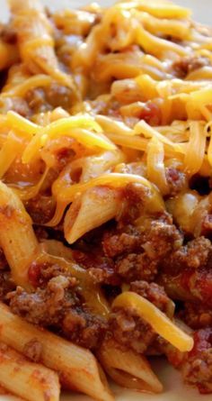 pasta with cheese and ground beef on a white plate