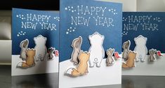 two new year cards with dogs on them